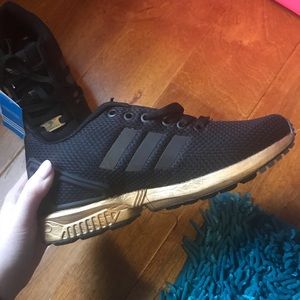 Adidas torsion black and gold running shoes